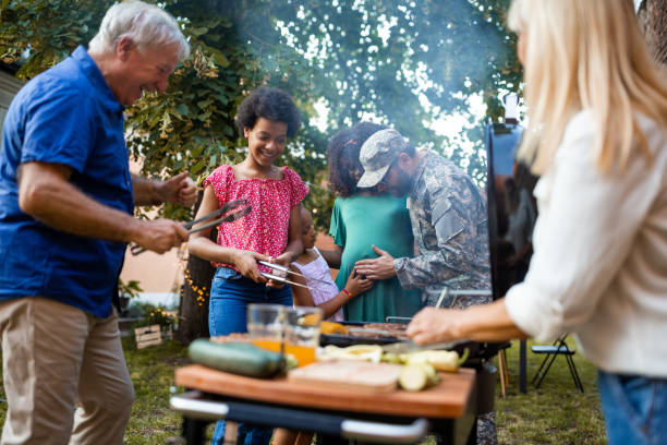 istock Multi-generation family grilling together at a barbecue party 1426565385