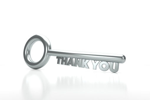The key to Thank You. Silver key that says Thank You on a white background. Planning Concept.