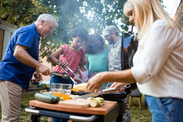 istock Multi-generation family grilling together at a barbecue party 1426566042