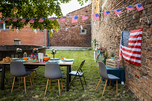 An empty outdoors dinner table prepared for American holiday celebration