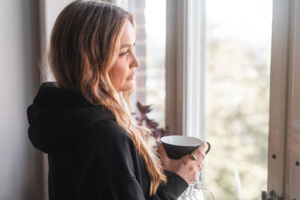 istock Woman taking a break to relax by the window 1426567955