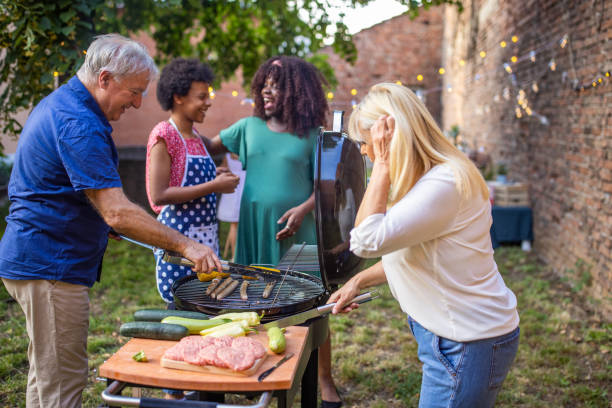 istock Multi-generation family grilling together at a barbecue party 1426570847