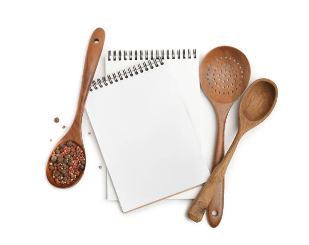 istock Blank recipe books, spices and wooden utensils on white background. Space for text 1426575615