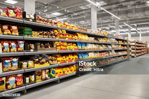istock Chips and snacks on shelves in supermarket 1426576928