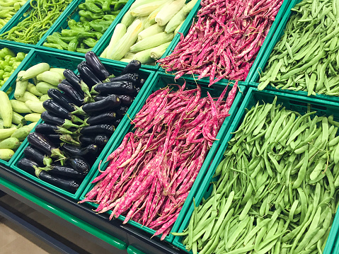 Fresh vegetables in the supermarket, various healthy food fresh vegetables, eggplant, zucchini, green bean, kidney bean, green chili pepper, green bell pepper