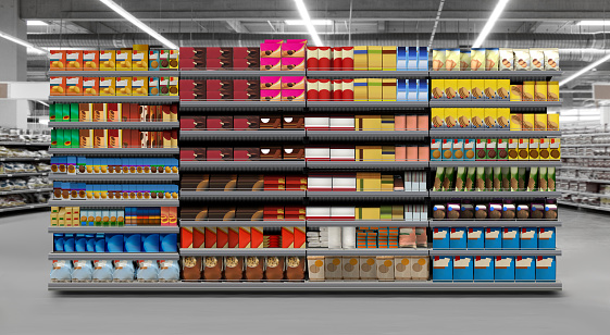 Interior of supermarket full of grocery items in rows with shelf displayed