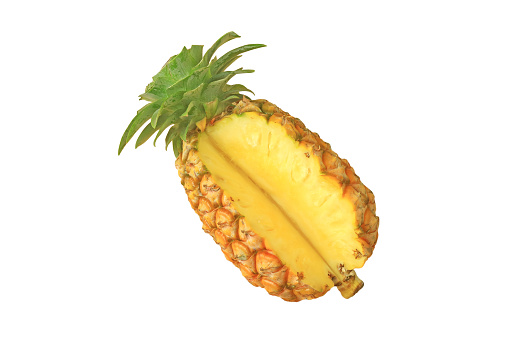Whole pineapple with pineapple slices  on white background.