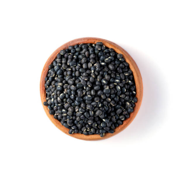 istock Black Lentils (Maa de Daal, Black matpe beans, Black urad, urad whole). Lentils in Pottery 1426587693