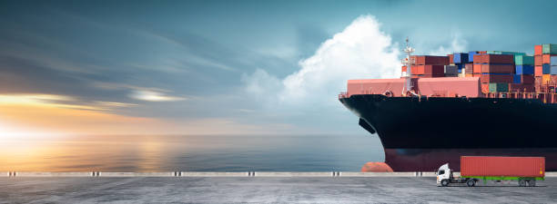 istock Containers cargo logistics import export transport concept, Big ship in the ocean and container truck at sunset dramatic sky background with copy space, Nautical vessel and sea freight shipping 1426592458