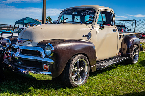 Daytona Beach, FL - November 28, 2020: Low perspective front corner view of a 1954 Chevrolet Advance Design 3100 Pickup Truck at a local car show.