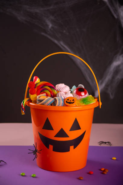 istock Halloween Jack o Lantern orange bucket with candy 1426605362