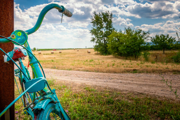 A Bike by the lake with clear blue summer sky.
