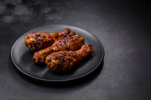 istock Delicious ruddy grilled chicken legs with spices and herbs 1426609657