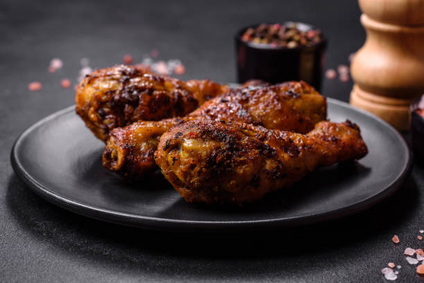 istock Delicious ruddy grilled chicken legs with spices and herbs 1426609672