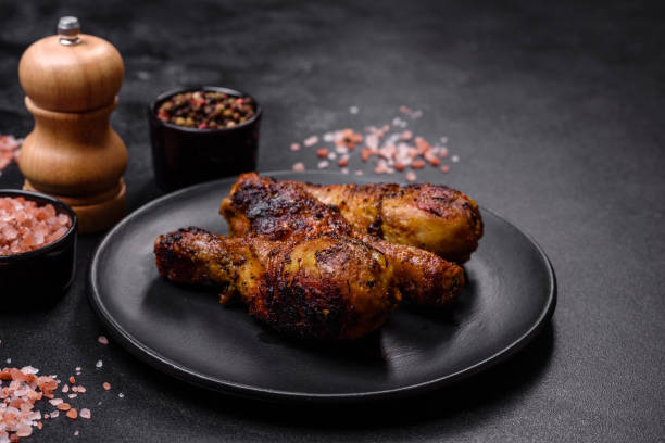 istock Delicious ruddy grilled chicken legs with spices and herbs 1426609698