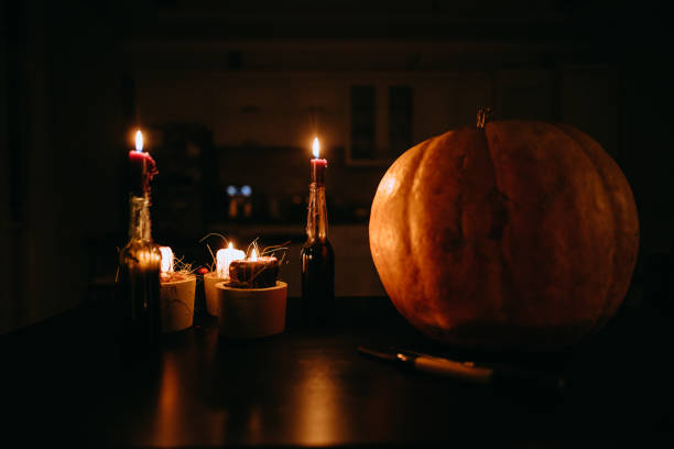 istock The pumpkin on the table by candlelight on Halloween 1426610700