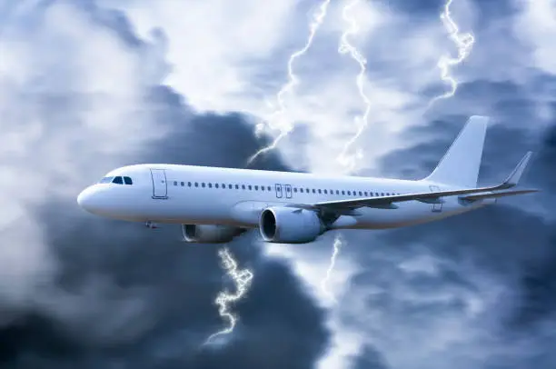 Photo of Airplane in the sky with thunder and lightning,The plane flies in terrible thunderstorm,Concept of climate weather