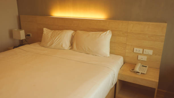 istock Pillows on wooden bed decoration in modern bedroom interior 1426616117