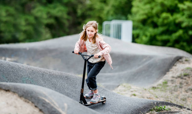 istock Girl with scooter 1426616407