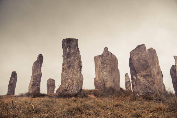 Ancient magic in the Calanais Standing Stones Circle, erected by neolithic men for worship. Celtic traditions in the outer hebrides of Scotland. Touristic attraction.