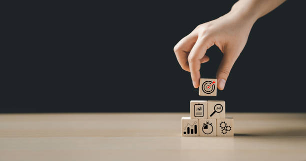 istock The action plan, business strategy target, hand assemble stack woods block step on the table with icon about. business development concept, way to the goal. 1426624283