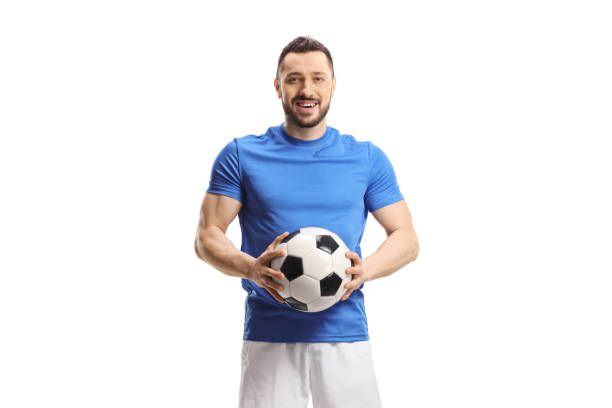 istock Soccer player holding a ball and looking at camera 1426626873
