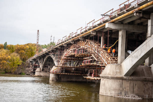 Scaffolding with a support system of beams Scaffolding with a support system of beams at the reconstruction of the bridge concrete in formwork stock pictures, royalty-free photos & images