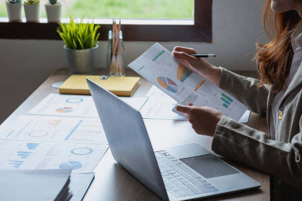 istock Businesswoman presenting profit data with graphs to her supervisor via laptop computer. 1426636218