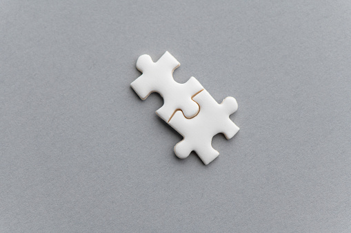 Bonding of two puzzle pieces.