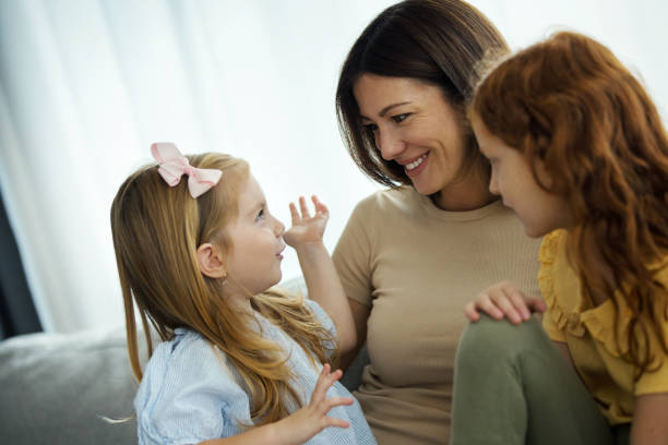 istock Mother and daughters having fun at home. 1426639953