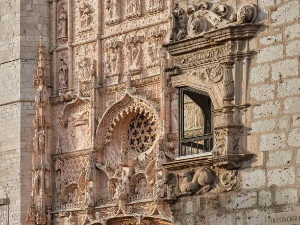 Photo of Window of the palace of Pimentel and facade of San Pablo in the background, Valladolid, Spain. King Philip II of Spain was born in this palace.