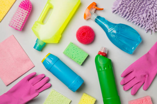 istock Many different house cleaning products on color background, top view 1426648380