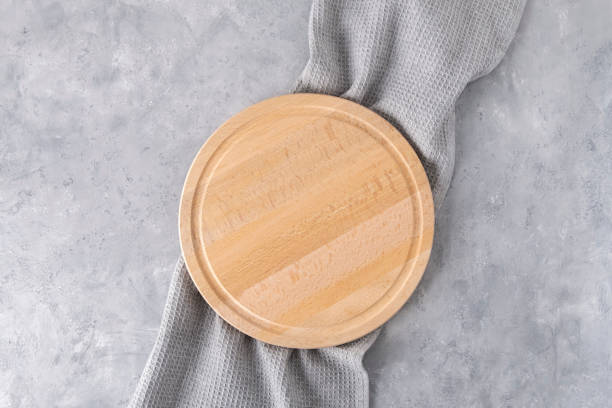 istock Cutting board with napkin on neutral grey background, top view, mockup 1426649287