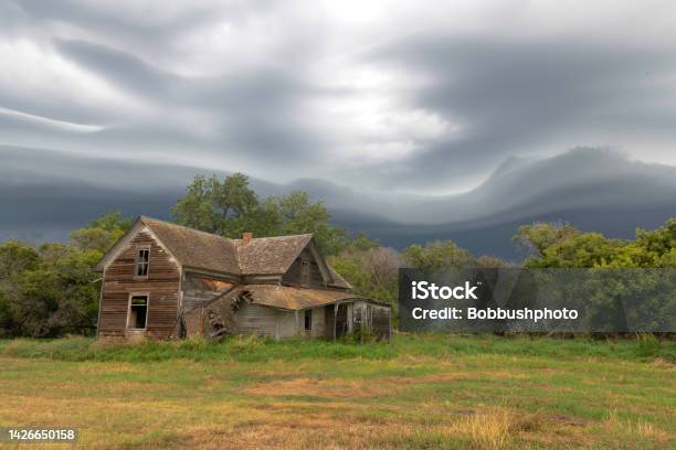 Storm Squall Over Abandoned Farmhouse In North Dakota Stock Photo - Download Image Now