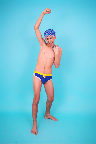 istock A young attractive guy washes in the shower. 1426651882