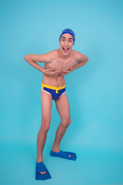 istock A young attractive guy washes in the shower. 1426652004