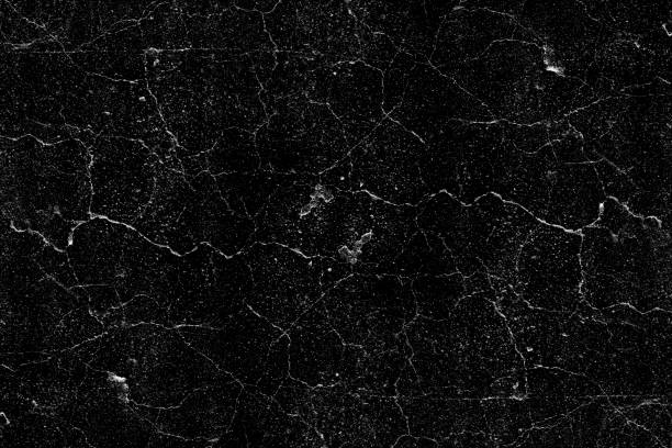 istock Black texture background with white crack lines and grunge 1426652414