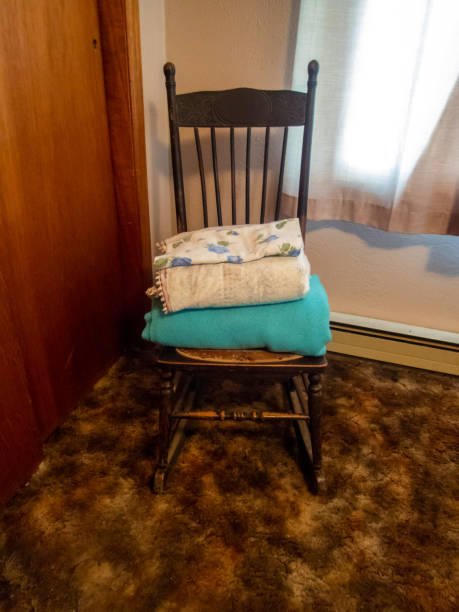 istock Blankets sit in old rocking chair in bedroom 1426658424