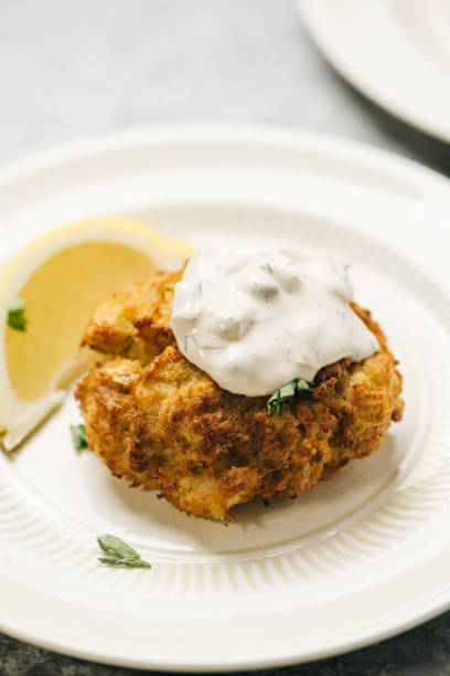 istock Crab Cake with lemon and Tartar Sauce 1426660341