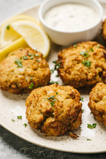 Crab cakes with lemon and tartar sauce in Frederick, Maryland, United States