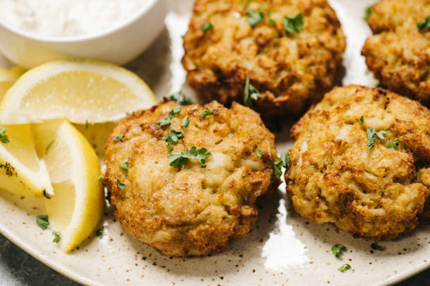 istock Homemade crab cakes on a plate with lemon 1426660372