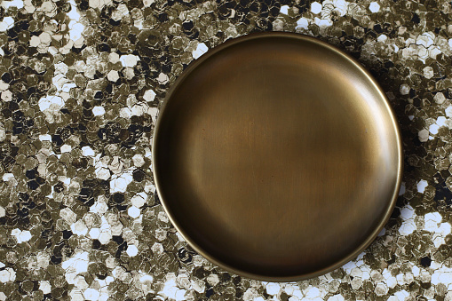 Blank copper plate on shiny glitter background