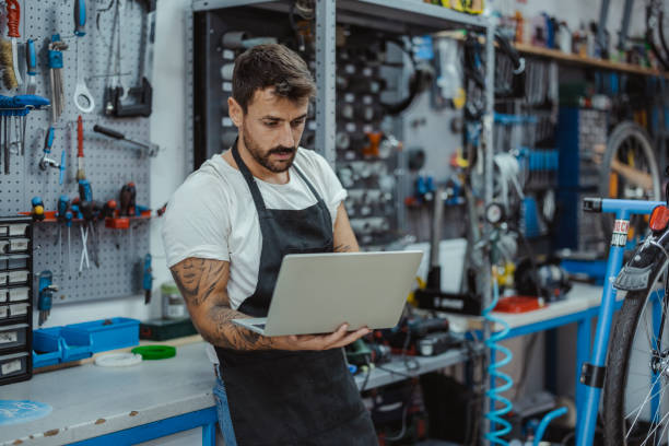 istock Bike Shop Owner using Laptop 1426661807