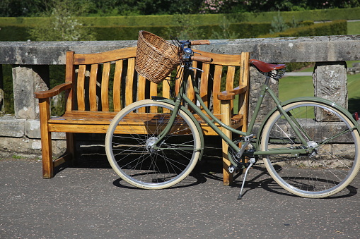 Bicycle propped against a bench