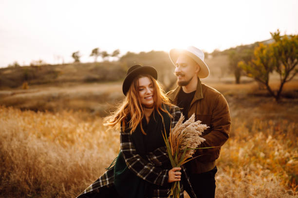 istock Lovely hipster couple resting in nature. 1426666982