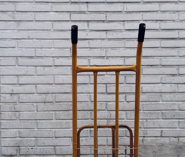 istock Yellow Barrow on White Brick Wall 1426669850