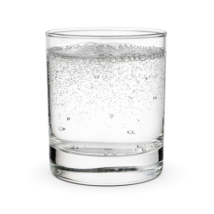 View of one single glass with fresh water at normal temperature on white background.