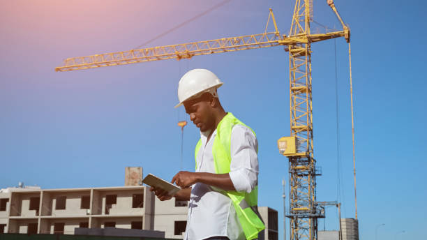 istock African American man types report about building at sunlight 1426672328