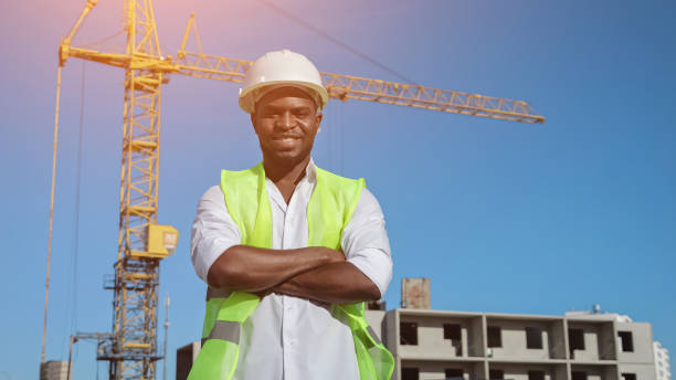istock African American builder looks with happy expression by crane 1426672339