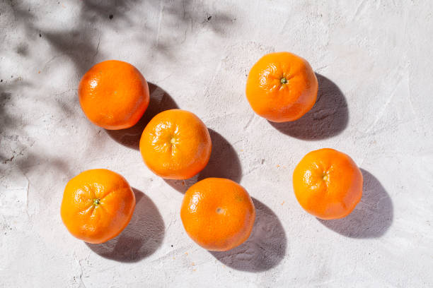istock pile of fresh tangerines on the concrete table 1426678323